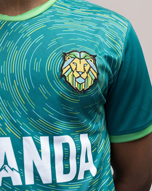 Rwanda Intare jersey by KIZA close-up of lion crest patch in Rwandan flag colors