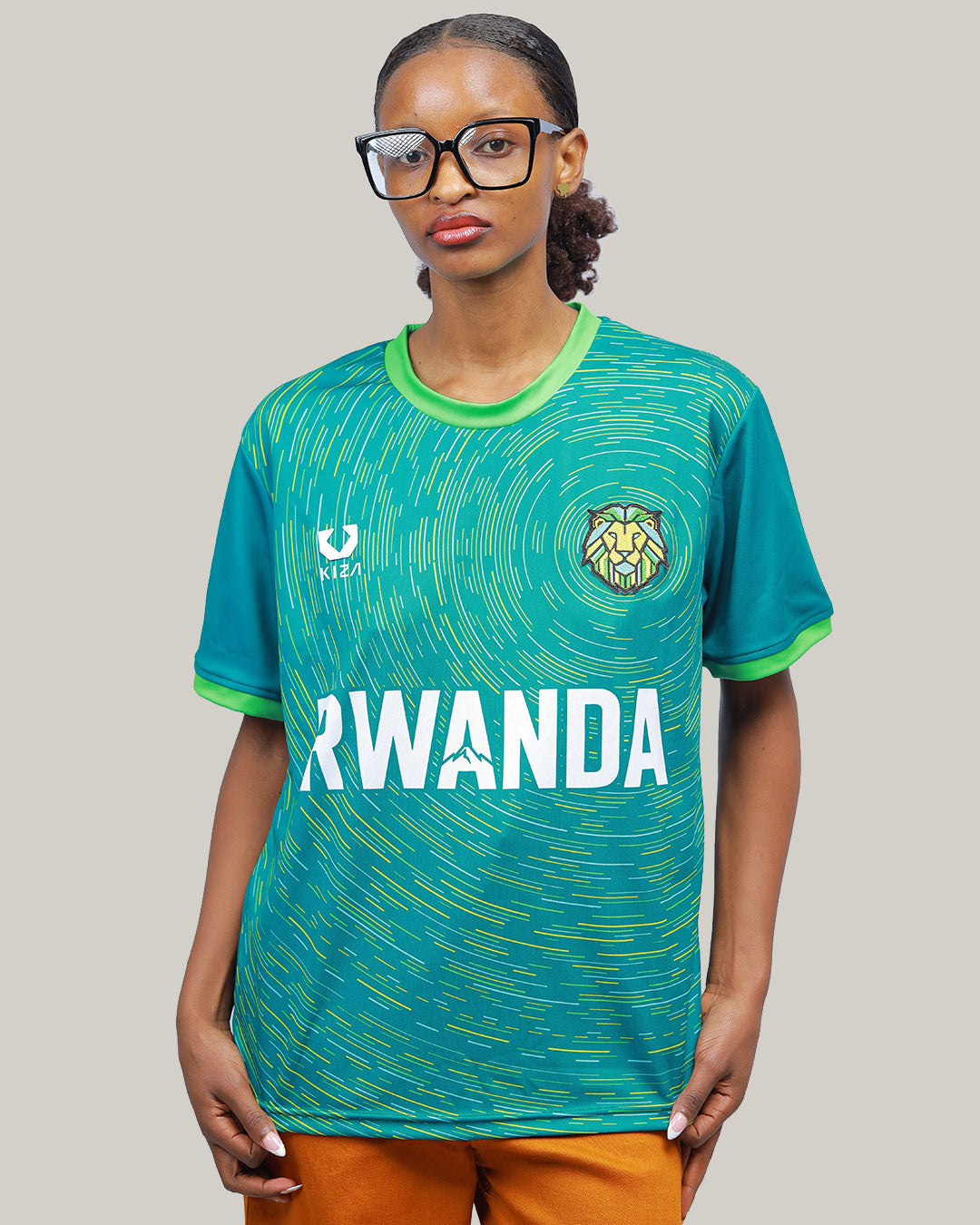 Rwanda Intare green jersey flat lay on grass with lion patch and concentric circles