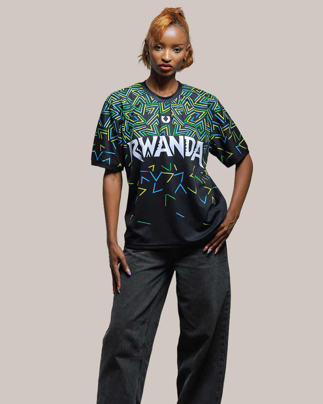 Close-up of geometric thunder print in blue yellow and green on KIZA Rwanda Inkuba black jersey